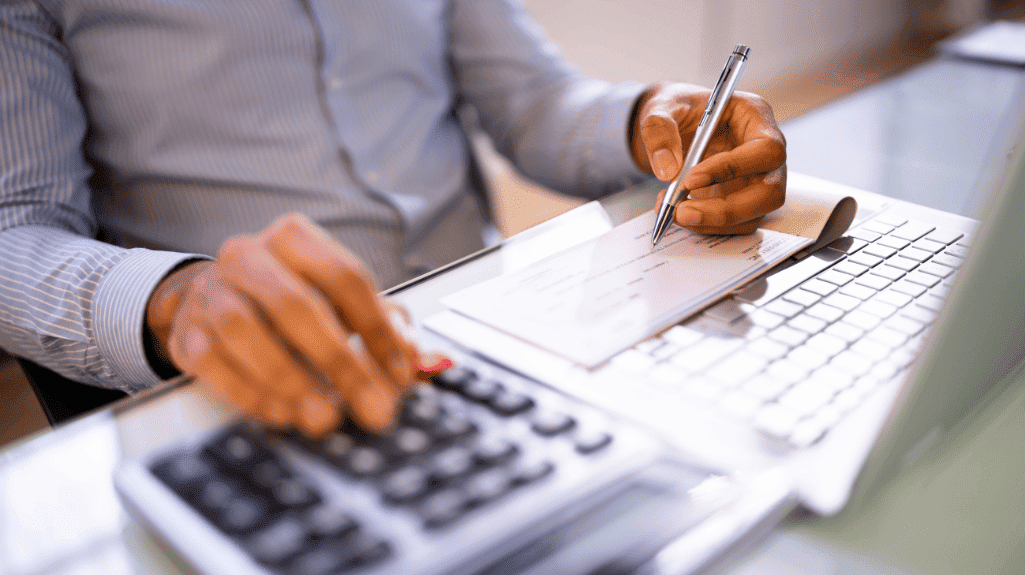 man calculating payroll